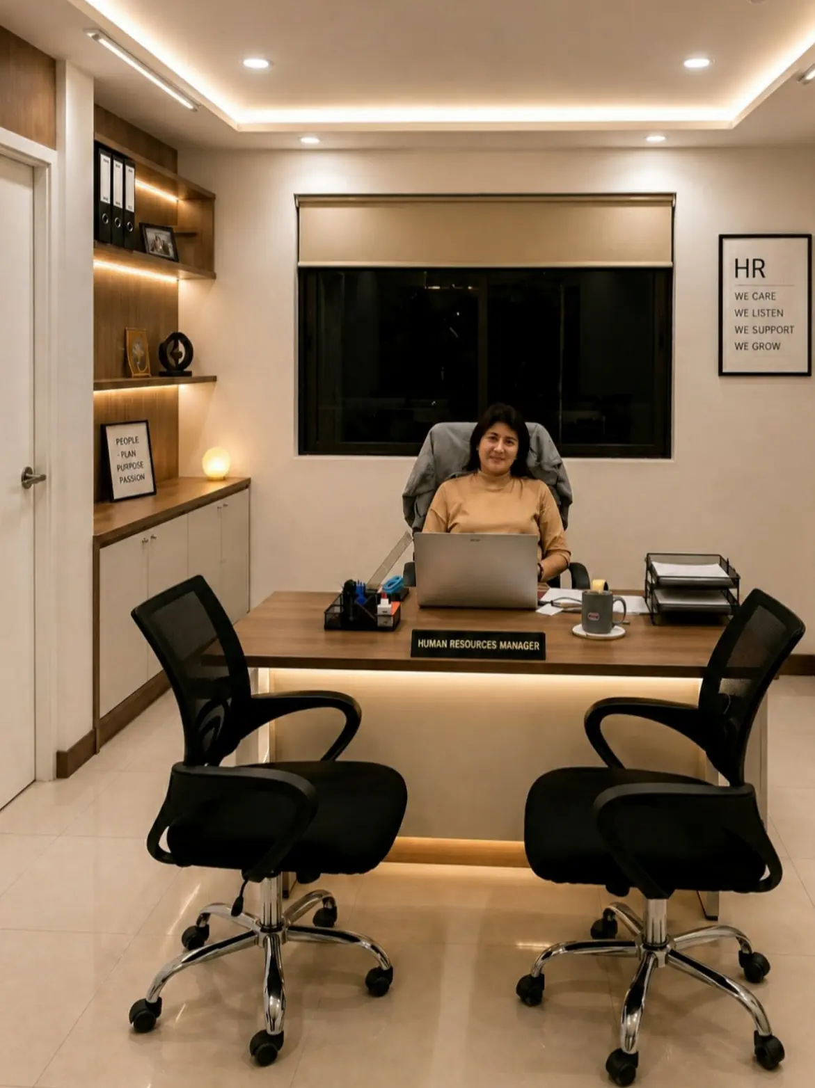 The human resources manager's office, with a meeting desk and HR values wall art